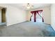 Living room with ceiling fan, curtains, and sliding door access to the patio at 2920 Ewell Rd, Lakeland, FL 33811