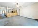 Open floor plan with living area connected to kitchen with partial wall at 2920 Ewell Rd, Lakeland, FL 33811