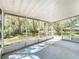 Bright screened porch that provides panoramic views of the lush, green backyard at 2920 Ewell Rd, Lakeland, FL 33811