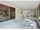 Large screened porch with outdoor access and ceiling with natural light at 2920 Ewell Rd, Lakeland, FL 33811