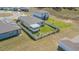 Aerial view of fenced backyard with screened in porch, perfect for outdoor enjoyment at 928 Cambridge Dr, Winter Haven, FL 33881
