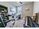 Bedroom featuring carpet, a ceiling fan, a window, art, and a desk at 928 Cambridge Dr, Winter Haven, FL 33881