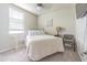 Bedroom featuring carpet, ceiling fan, window, bed and furniture at 928 Cambridge Dr, Winter Haven, FL 33881