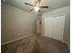 Bedroom featuring carpet, ceiling fan, closet, and neutral colors at 928 Cambridge Dr, Winter Haven, FL 33881