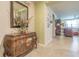 Warm entryway with decorative chest and doorway leading to a spacious living area at 928 Cambridge Dr, Winter Haven, FL 33881