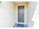 Close-up of the home's inviting front door with stylish exterior details at 928 Cambridge Dr, Winter Haven, FL 33881