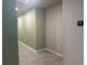Hallway with tiled floor and painted in neutral colors at 928 Cambridge Dr, Winter Haven, FL 33881