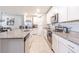 Bright kitchen featuring granite countertops, stainless steel appliances, and tiled flooring at 928 Cambridge Dr, Winter Haven, FL 33881