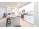 Modern kitchen with granite countertops, stainless steel appliances, and a center island at 928 Cambridge Dr, Winter Haven, FL 33881