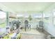 Bright sunroom with brick floor, multiple windows, and casual seating for relaxing or entertaining at 928 Cambridge Dr, Winter Haven, FL 33881