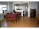 Bright dining room featuring hardwood floors and an open layout to the kitchen at 114 1St Nw St, Fort Meade, FL 33841