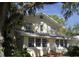 Classic two-story home with mature landscaping and a welcoming front entrance at 114 1St Nw St, Fort Meade, FL 33841