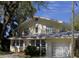 Charming two-story home with a well-manicured lawn and classic architectural details at 114 1St Nw St, Fort Meade, FL 33841
