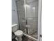 Bathroom with tile flooring, modern toilet and beautiful glass enclosed shower at 716 Byni Rdg, Winter Haven, FL 33880