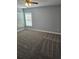 Bedroom with carpet flooring, two windows, and neutral wall color at 716 Byni Rdg, Winter Haven, FL 33880