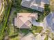 Aerial view of a home featuring a well-maintained roof, lush lawn, and manicured landscaping at 1229 Sebastian Cv, Lake Mary, FL 32746