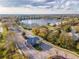Aerial view of a gated community with scenic lake views, featuring a beautiful water fountain at 1229 Sebastian Cv, Lake Mary, FL 32746