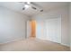 Bright bedroom featuring neutral walls, a ceiling fan, and a double-door closet at 1229 Sebastian Cv, Lake Mary, FL 32746