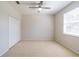 Bedroom with a ceiling fan, a double door closet, and a window at 1229 Sebastian Cv, Lake Mary, FL 32746