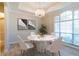 Formal dining room boasts a modern chandelier and sunlit windows at 1229 Sebastian Cv, Lake Mary, FL 32746