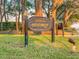 Welcome to Heathrow sign surrounded by lush green grass and mature trees, inviting you into the community at 1229 Sebastian Cv, Lake Mary, FL 32746