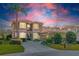 Beautiful two-story home with a well-manicured lawn, lush landscaping, and a grand entryway at 1229 Sebastian Cv, Lake Mary, FL 32746