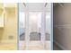 Hallway featuring walk-in closets on the left and a primary bath through a doorway at 1229 Sebastian Cv, Lake Mary, FL 32746
