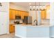 Modern kitchen with stainless steel appliances, light wood cabinets and granite counters with an island at 1229 Sebastian Cv, Lake Mary, FL 32746