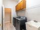 Laundry room with washer, dryer, utility sink, and cabinets at 1229 Sebastian Cv, Lake Mary, FL 32746