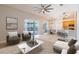 Open floor plan seamlessly connects living room, dining area, and modern kitchen at 1229 Sebastian Cv, Lake Mary, FL 32746