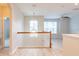 Upstairs loft area with wood railing, neutral walls and natural light at 1229 Sebastian Cv, Lake Mary, FL 32746