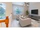 Open loft area with seating, large windows and plenty of natural light at 1229 Sebastian Cv, Lake Mary, FL 32746