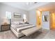Elegant main bedroom with a neutral color scheme, tray ceiling, and windows providing natural light at 1229 Sebastian Cv, Lake Mary, FL 32746