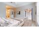 Bright main bedroom with a tray ceiling, neutral color scheme, and sliding doors to the lanai at 1229 Sebastian Cv, Lake Mary, FL 32746