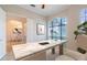 The office features a sleek desk, large windows, and calming decor at 1229 Sebastian Cv, Lake Mary, FL 32746