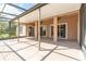 Large screened-in patio with concrete flooring, ceiling fans, and views of the garden at 1229 Sebastian Cv, Lake Mary, FL 32746