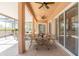 A delightful patio setup with ample seating, ideal for dining and enjoying the outdoor views with ceiling fans at 1229 Sebastian Cv, Lake Mary, FL 32746