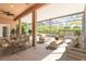 An inviting screened patio featuring comfortable seating and a dining area, perfect for outdoor entertaining and relaxation at 1229 Sebastian Cv, Lake Mary, FL 32746