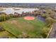 Aerial view of a large recreation field with soccer nets, a baseball diamond, and a basketball court at 1229 Sebastian Cv, Lake Mary, FL 32746