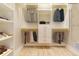 Well-organized walk-in closet with custom shelving and hanging rods for optimal storage at 1229 Sebastian Cv, Lake Mary, FL 32746