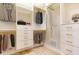 Customizable walk-in closet featuring drawers, shelving, and hanging space for organized storage at 1229 Sebastian Cv, Lake Mary, FL 32746