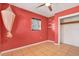 Brightly painted bedroom featuring tile flooring, a ceiling fan, and closet at 2421 Cypress Ln, Lakeland, FL 33801