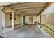 Spacious carport with front door access, seating, and neutral colors at 2421 Cypress Ln, Lakeland, FL 33801