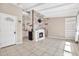 Bright living room featuring a decorative fireplace, open layout, and tiled flooring at 2421 Cypress Ln, Lakeland, FL 33801