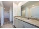 Bathroom featuring double sinks with granite countertops and tiled floors at 2506 Linda Knoll Ln, Bartow, FL 33830
