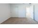Bedroom with sliding door closet, neutral carpet, and doorway at 2506 Linda Knoll Ln, Bartow, FL 33830