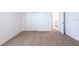 Bedroom with sliding door closet, neutral carpet, and doorway to bathroom at 2506 Linda Knoll Ln, Bartow, FL 33830