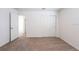 Bedroom with sliding door closet, neutral carpet, and doorway at 2506 Linda Knoll Ln, Bartow, FL 33830