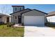 Charming single-Gathering home with a two-car garage and well-manicured front lawn at 2506 Linda Knoll Ln, Bartow, FL 33830