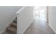 Bright hallway with gray tile flooring leading to an open living space at 2506 Linda Knoll Ln, Bartow, FL 33830